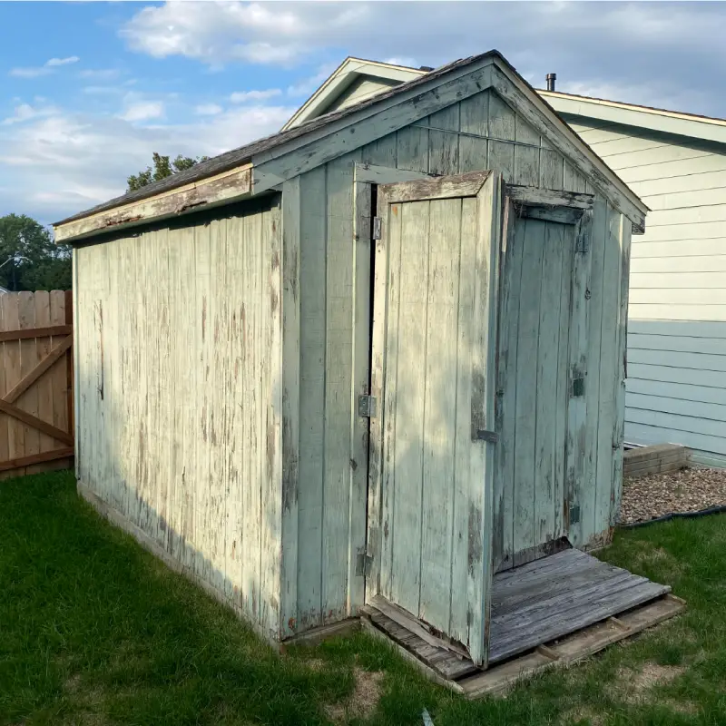 Ipswich Property Clearance team just about to remove wooden shed panels.
